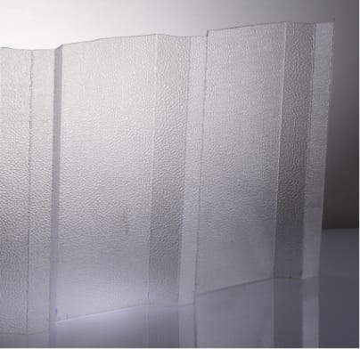 A translucent textured polycarbonate sheet with a frosted, pebbled surface, shown standing upright against a neutral gray background.