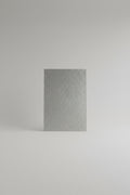 A textured clear embossed sheet with a crinkled, hammered surface' use in roofing.