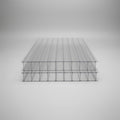 10mm Clear ribbed polycarbonate solar panel sheets stacked on a blue surface, showing their transparent structure and corrugated design.