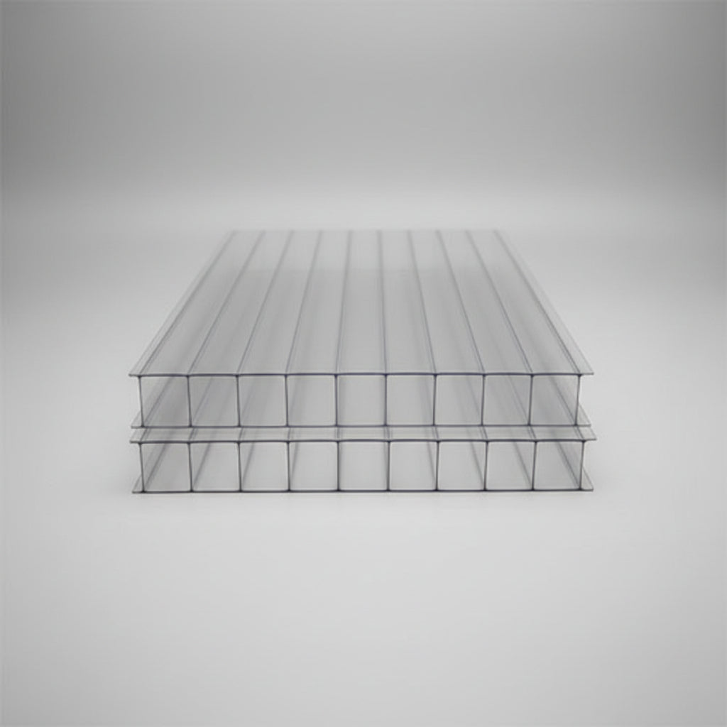 10mm Clear ribbed polycarbonate solar panel sheets stacked on a blue surface, showing their transparent structure and corrugated design.